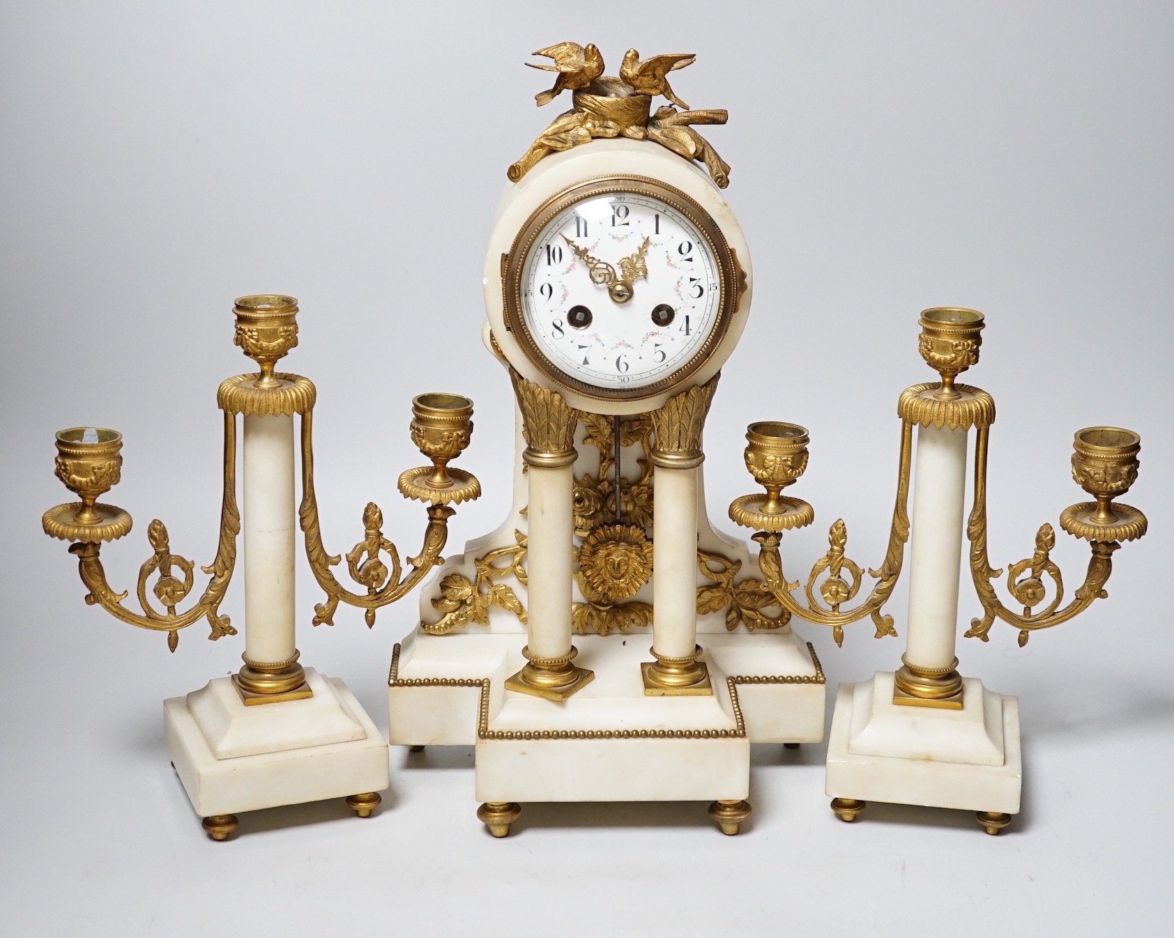 A 19th century alabaster clock garniture, French movement count-wheel striking on a bell, clock 34cm